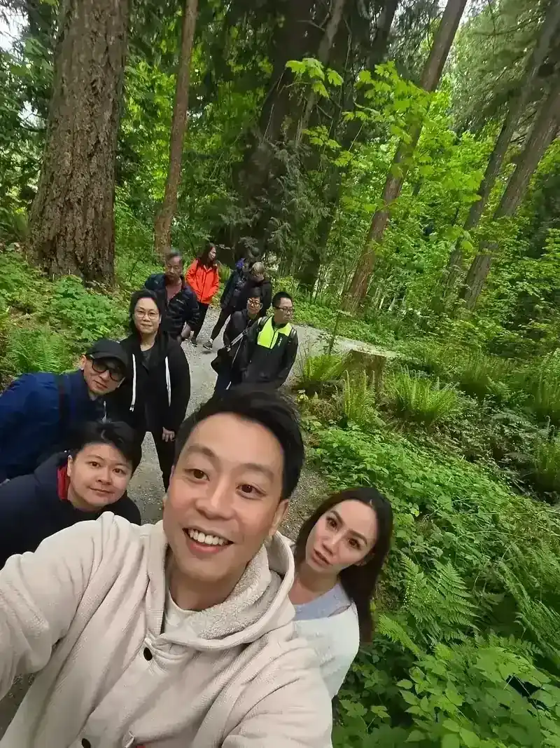 Ken and his family on a forest trail